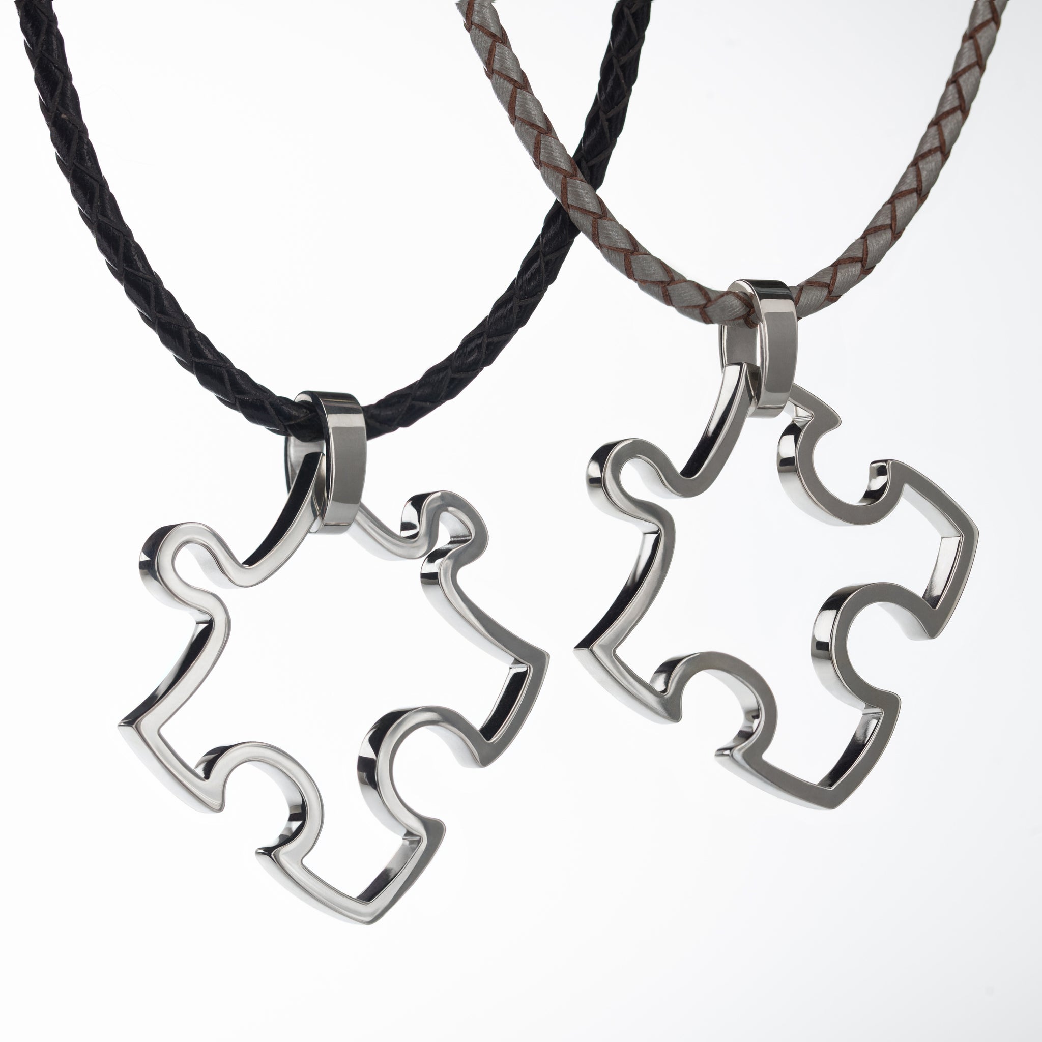Two conceptual puzzle  pendants made of stainless steal